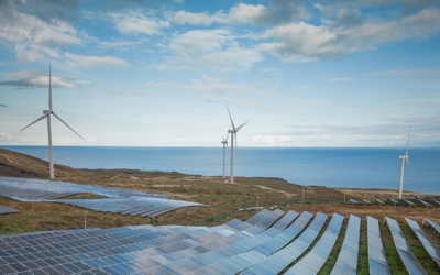 Symbolic image: wind farm and solar farm near the sea 